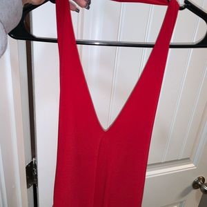 Low cut, open back red bodysuit